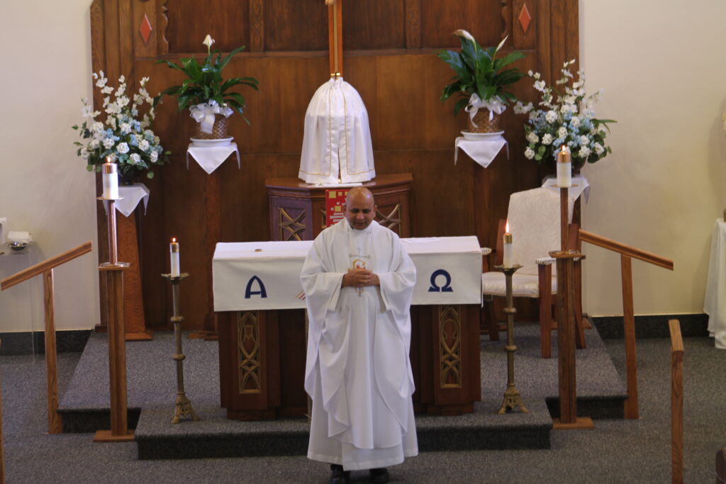 Fr. Nusi at the Alter